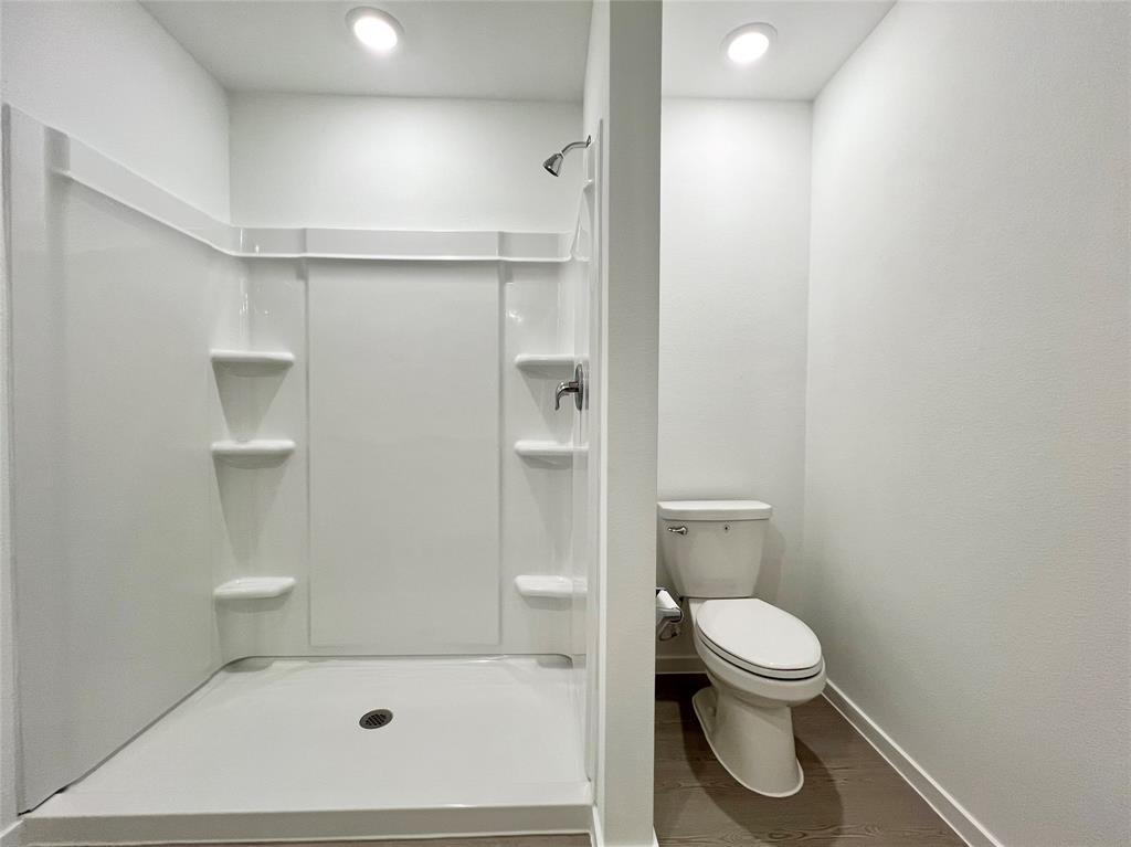 4012 Twinleaf Drive Crowley, TX 76036 - Photo 19 of 39 a bathroom with a toilet and a shower
