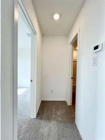 a view of a room with a hallway