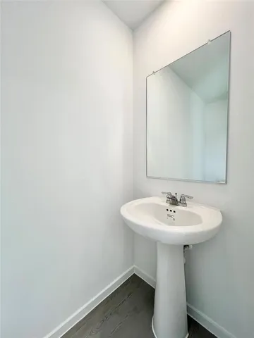 a white toilet sitting in a bathroom