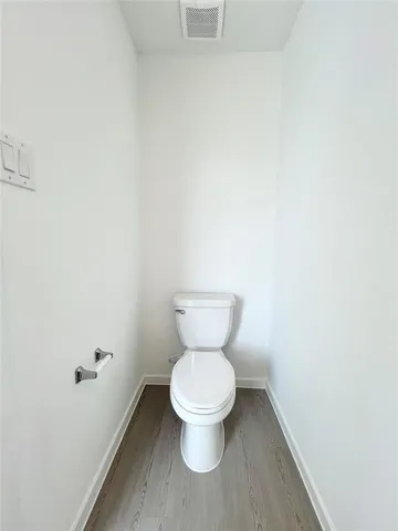 a view of hallway with wooden floor