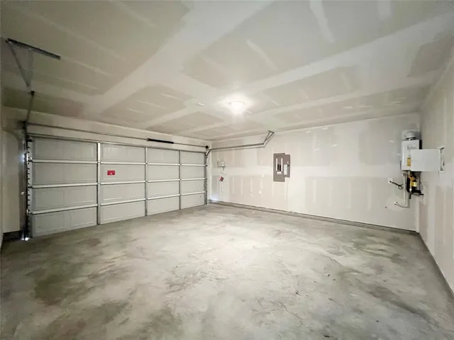 a large kitchen with stainless steel appliances granite countertop a stove and a refrigerator