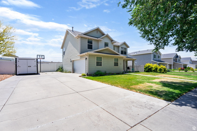 1393 West 150 North Springville, UT 84663 - Photo 2 of 31 Two-story residence featuring light-colored siding and a covered front porch