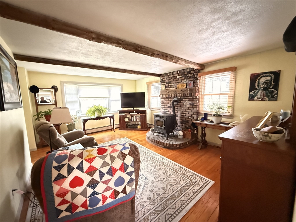 1 Anna Street Ware, MA 01082 - Photo 11 of 26 a living room with furniture and a flat screen tv