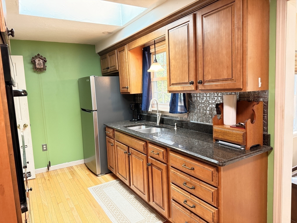 1 Anna Street Ware, MA 01082 - Photo 7 of 26 a kitchen with stainless steel appliances granite countertop next to a window