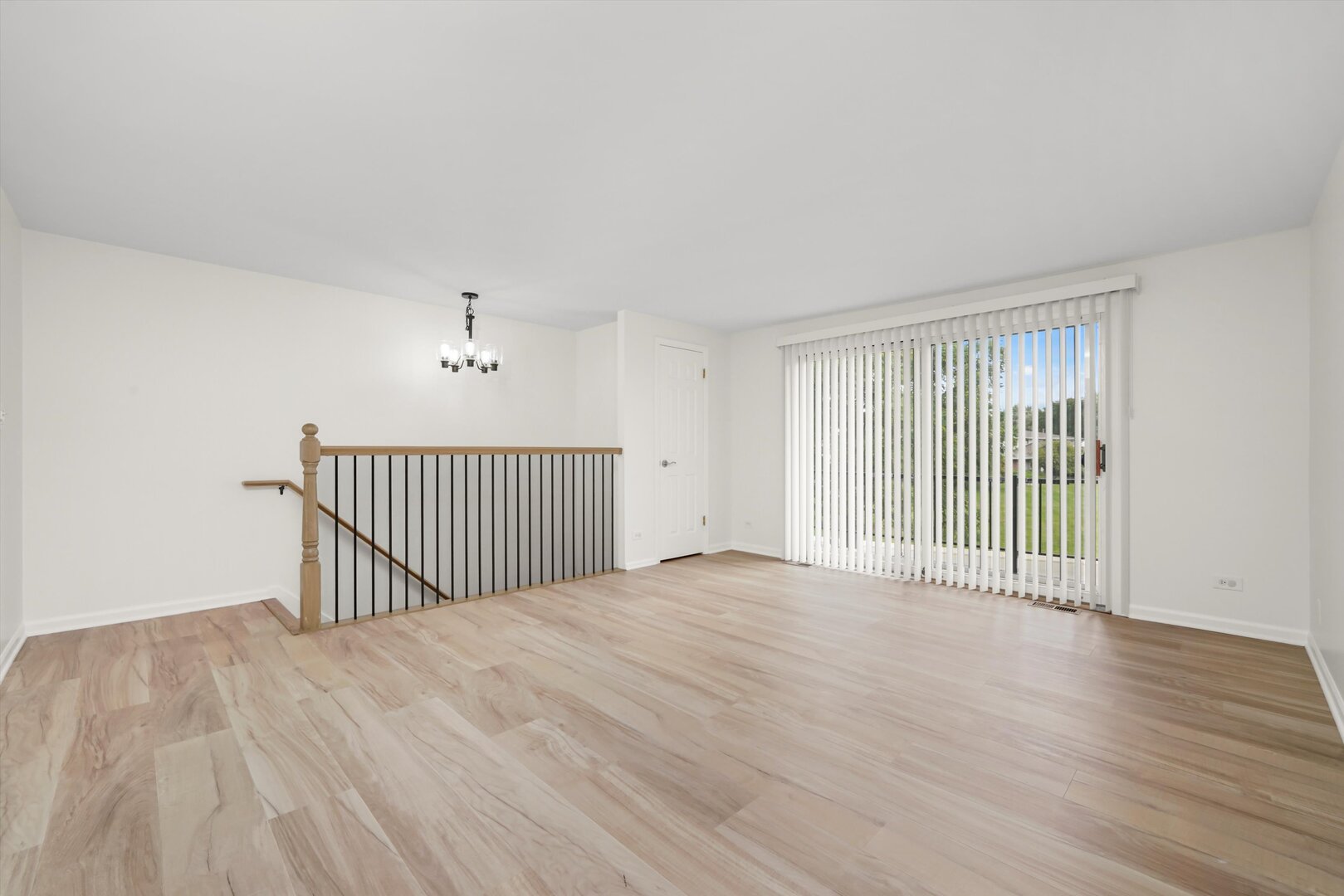 1100 Stoughton Court, Unit 1711 Schaumburg, IL 60193 - Photo 11 of 20 a view of a room with wooden floor and windows