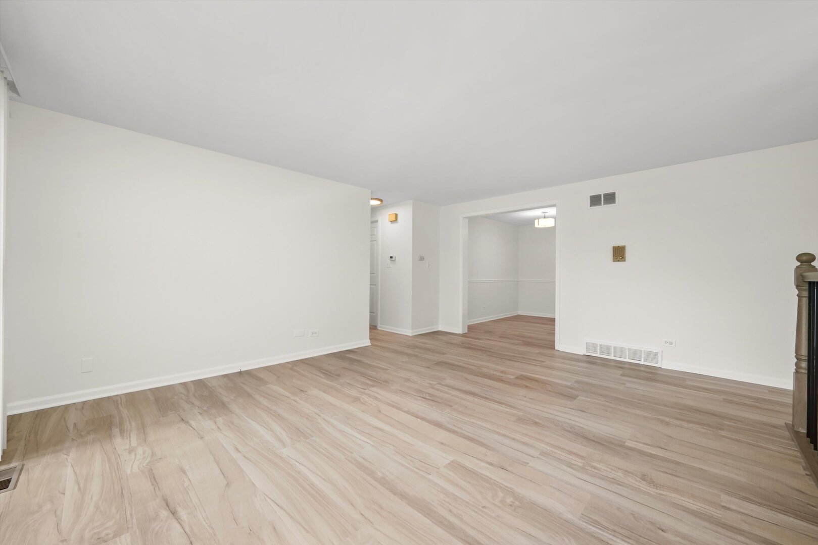 1100 Stoughton Court, Unit 1711 Schaumburg, IL 60193 - Photo 13 of 20 a view of an empty room with wooden floor