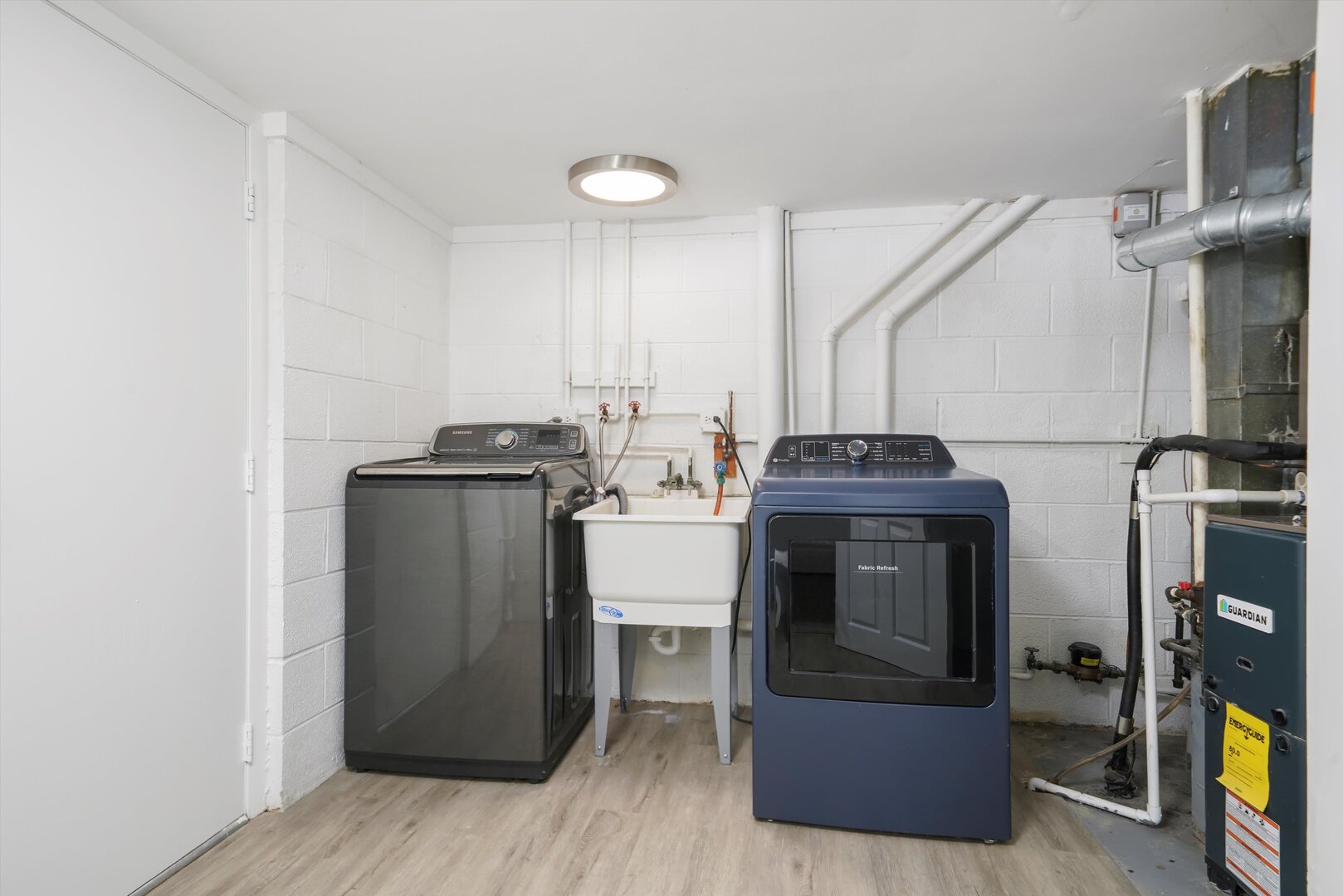 1100 Stoughton Court, Unit 1711 Schaumburg, IL 60193 - Photo 14 of 20 a view of a kitchen with fridge and wooden floor