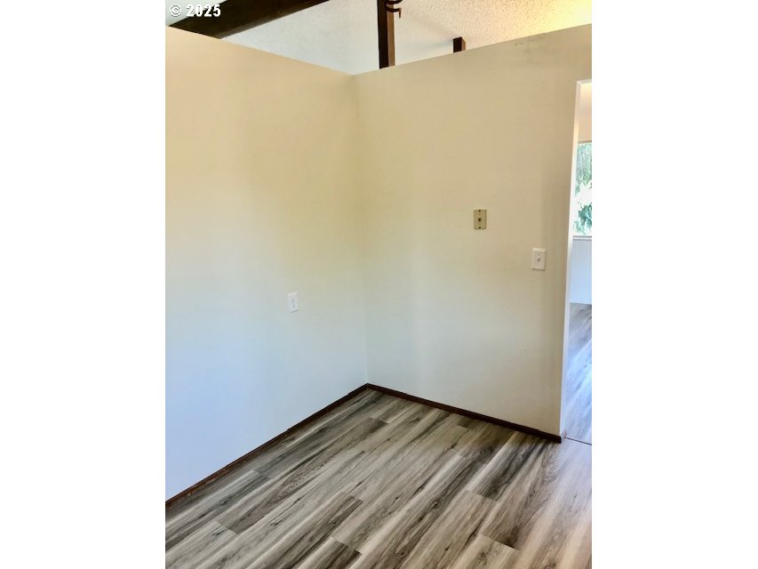 2765 Almaden Street Eugene, OR 97405 - Photo 8 of 24 a view of a room with wooden floor