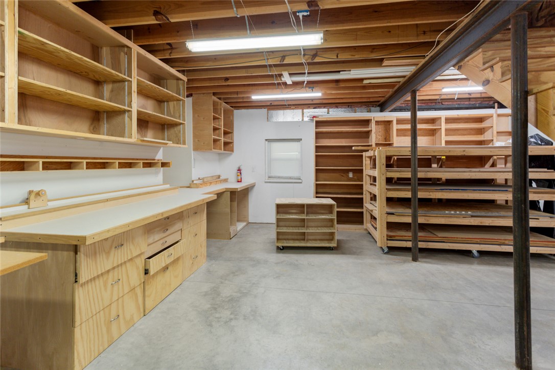 621 Burns Mill Road West Union, SC 29696 - Photo 24 of 45 Well-lit workshop with extensive built-in storage and durable concrete flooring.