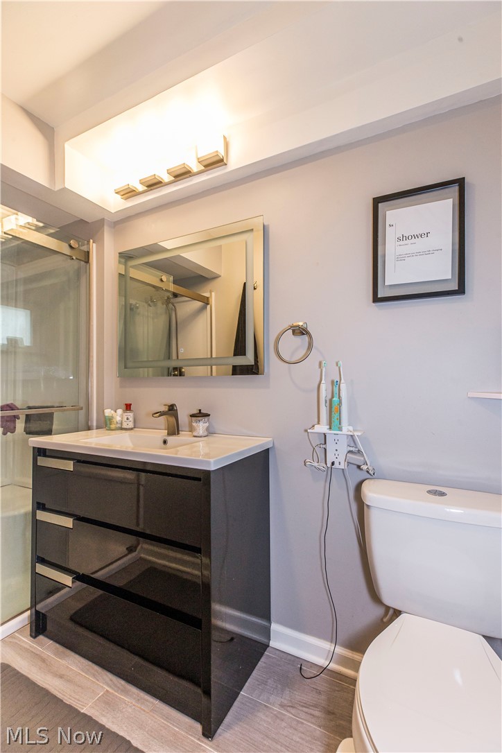 2095 Wyndham Road Akron, OH 44313 - Photo 27 of 40 Owners Suite Bathroom with vanity, wood-type flooring, and toilet