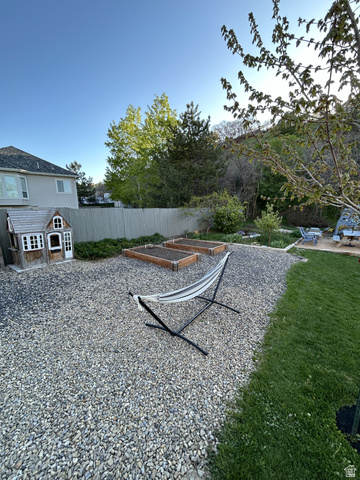 387 North Loafer Canyon Road Payson, UT 84651 - Photo 74 of 94 Spacious backyard featuring a gravel patio area with two raised garden beds