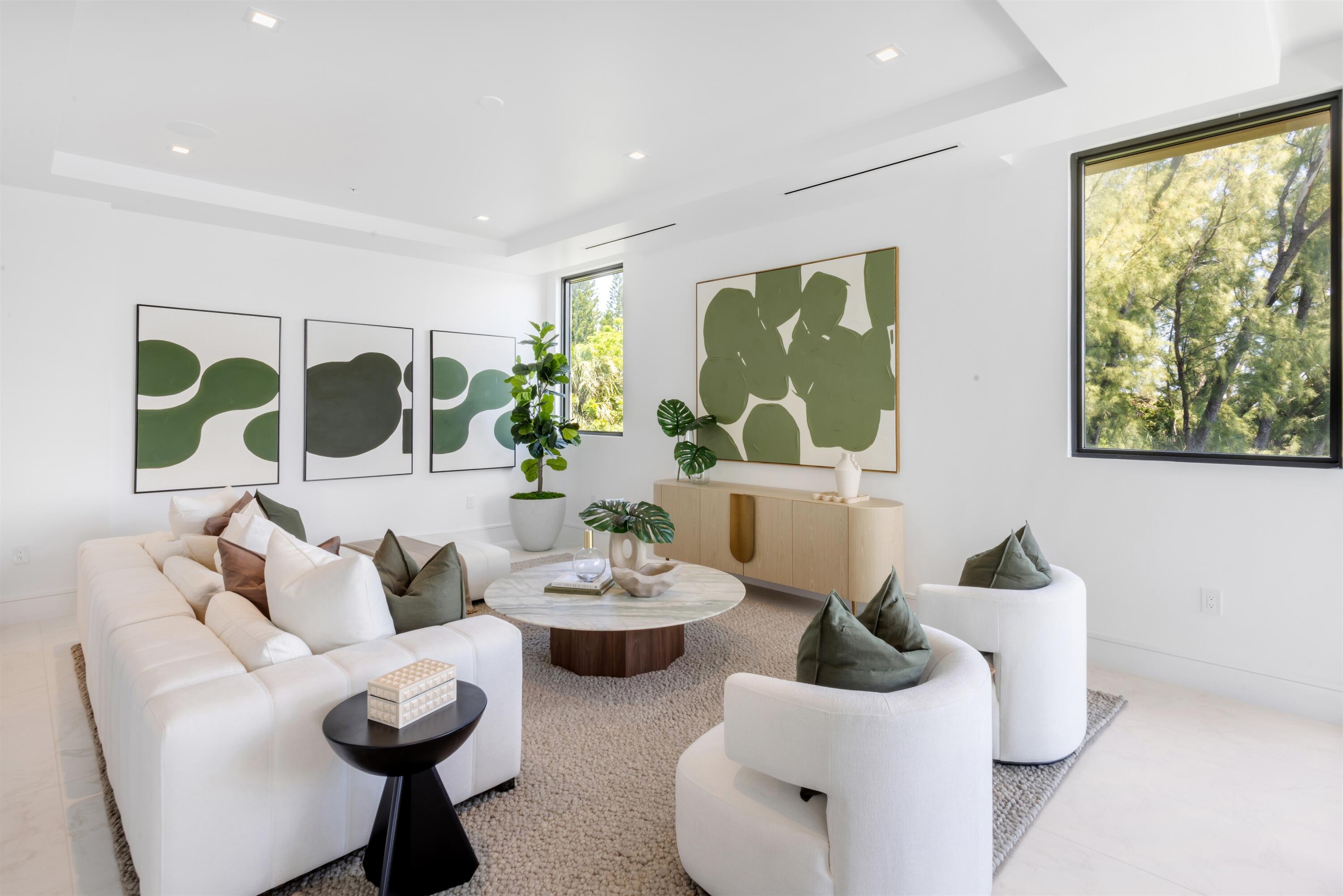 900 Lago Mar Lane, Unit PH Boca Raton, FL 33431 - Photo 17 of 58 a living room with furniture and a large window
