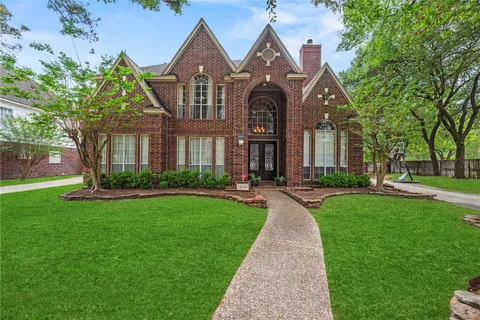 a front view of a house with yard