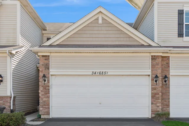 a view of house with garage