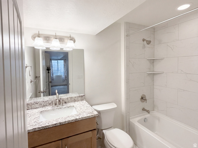 1251 North 2525 West Clinton, UT 84015 - Photo 22 of 30 Bathroom featuring a vanity with a granite-finish countertop, undermount sink, and brushed nickel faucet