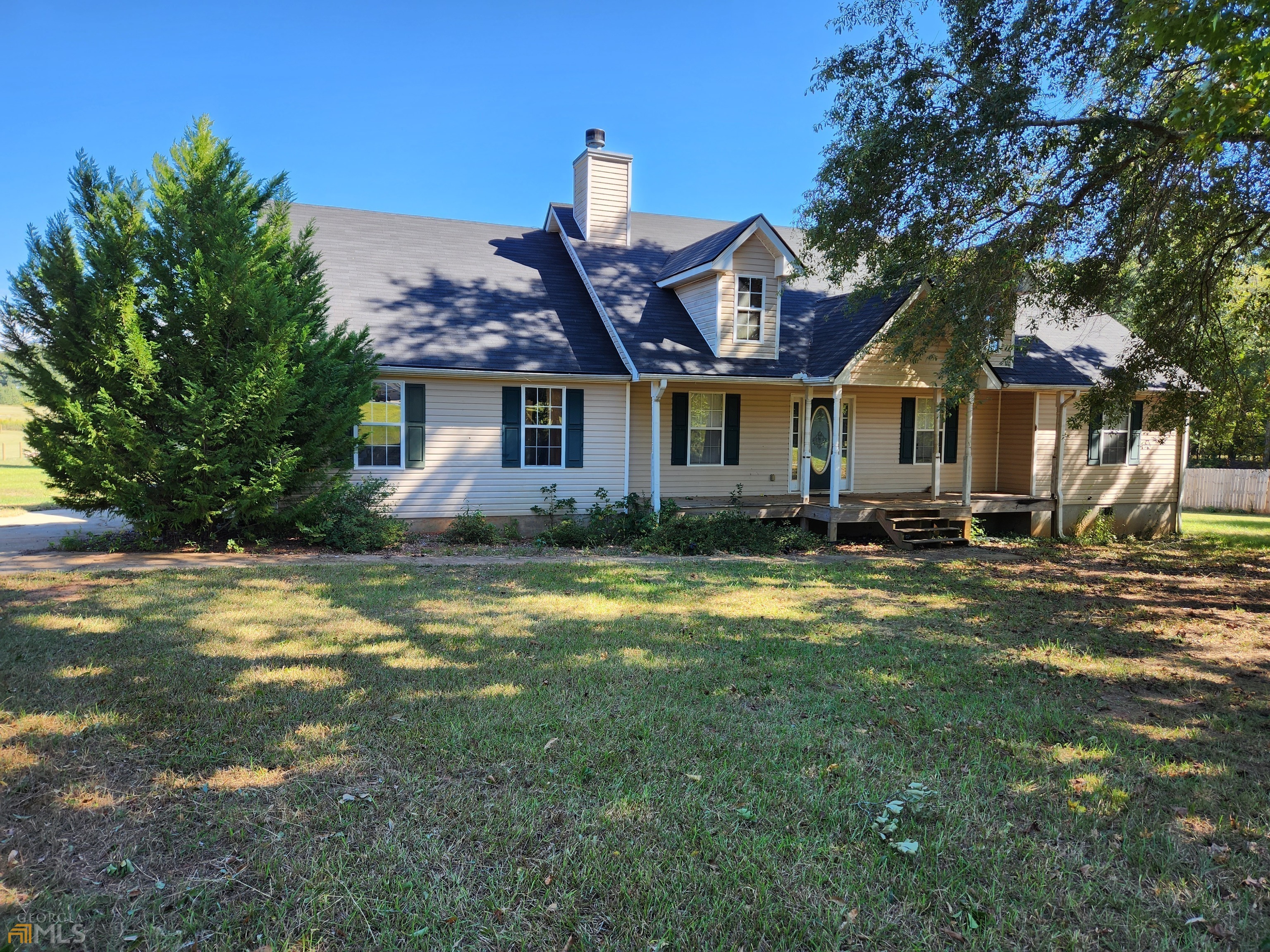 115 Jim McMichael Road Jackson, GA 30233 - Photo 1 of 1 a front view of a house with a yard