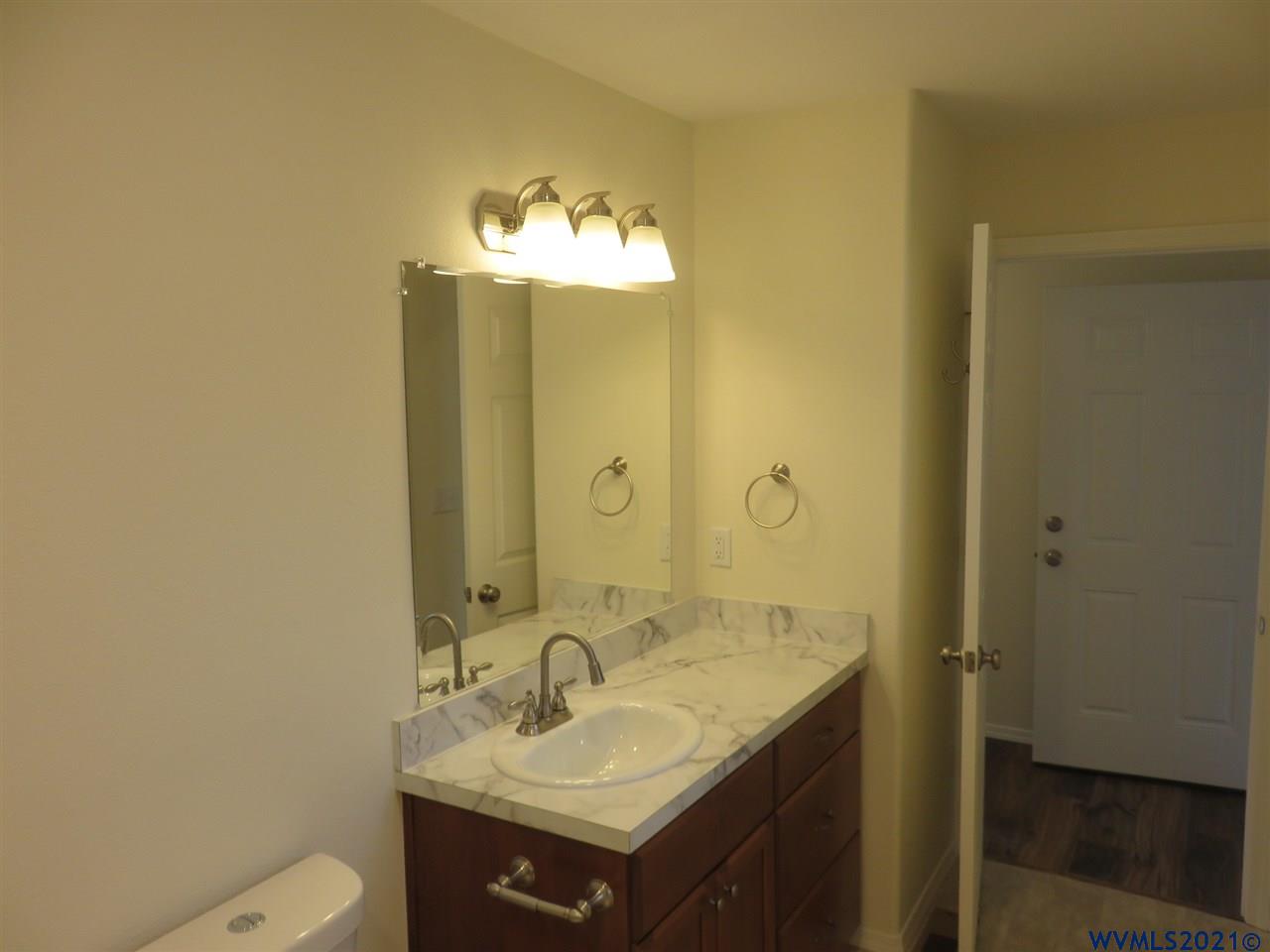 18990 Falls City Road Dallas, OR 97338 - Photo 38 of 42 a bathroom with a sink and a mirror