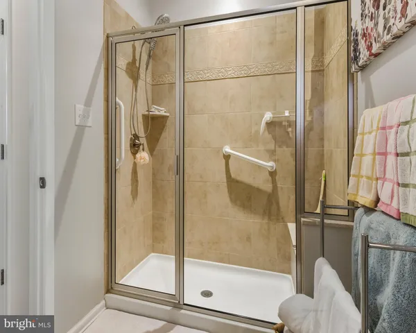 a bathroom with a glass shower door