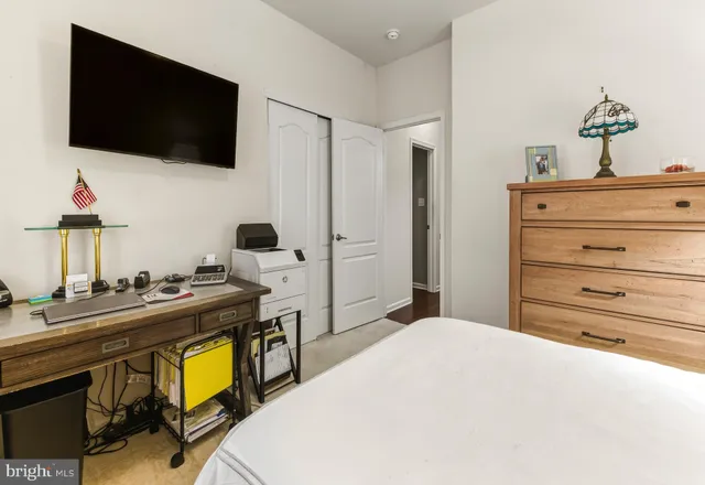 a bed room with a bed and a flat screen tv