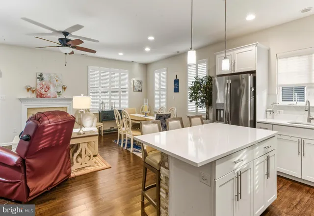 a view of kitchen with cabinets and wooden floor