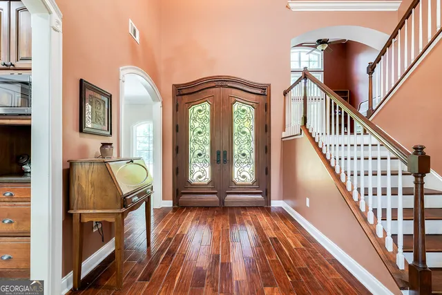 a view of front door with wooden floor