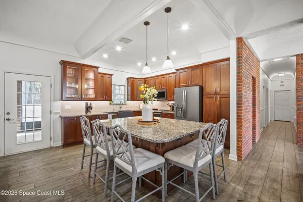 a kitchen with a sink and a window