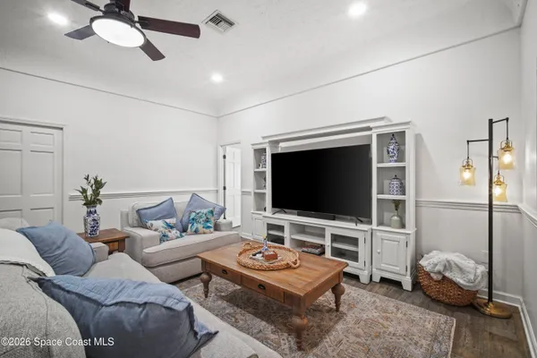 a bedroom with a bed and cabinets