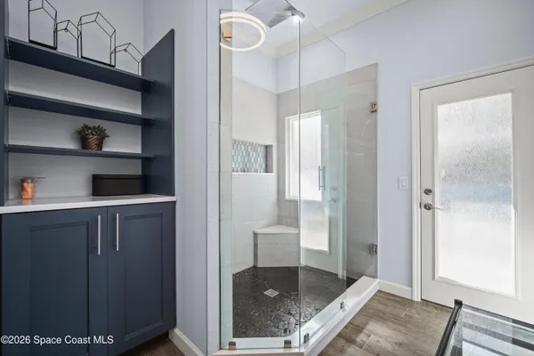 a bedroom with two beds and a window