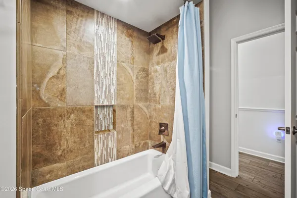 a view of a workspace with furniture and a rug