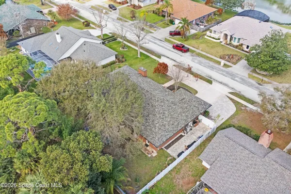an aerial view of a house with a lake view