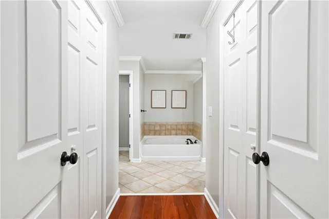 a bathroom with a tub shower and a sink