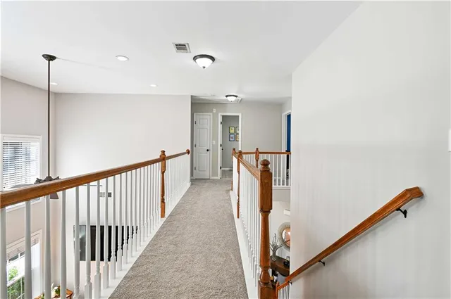 a view of a hallway with staircase
