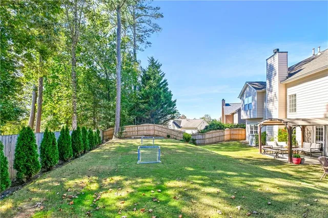a view of a swimming pool with a patio