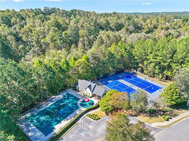 a view of a yard with an outdoor seating space