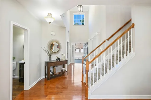 a view of an entryway with wooden floor