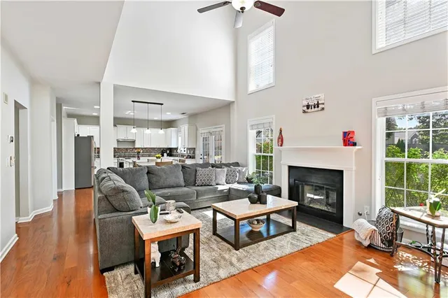 a living room with furniture fireplace and a table