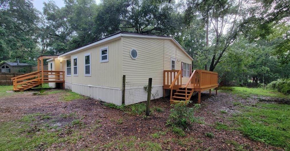 85205 Winona Bayview Road Yulee, FL 32097 - Photo 1 of 1 a house view with a backyard space
