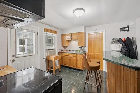 a room with dining table and chairs