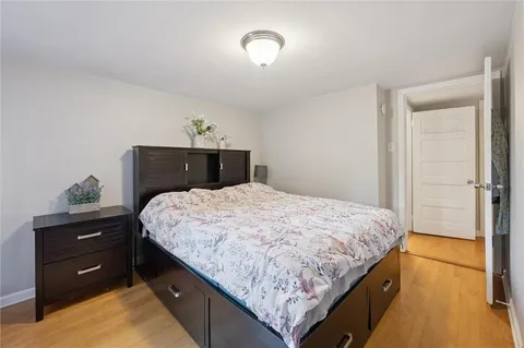 a bedroom with a bed and a dresser