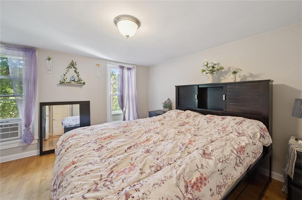 679 Greentree Road Pittsburgh, PA 15220 - Photo 15 of 25 a bedroom with a bed and a window