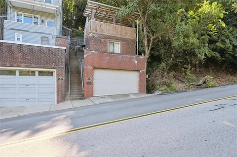 front view of a house with a street