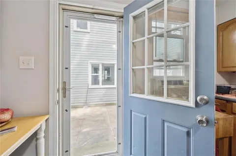 a view of a door and a window