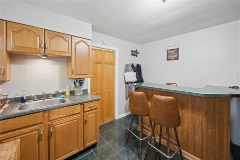a kitchen with stainless steel appliances granite countertop sink cabinets and stove