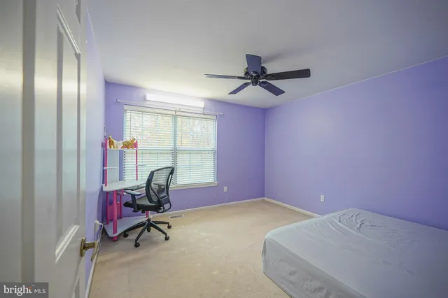 a bedroom with furniture and windows
