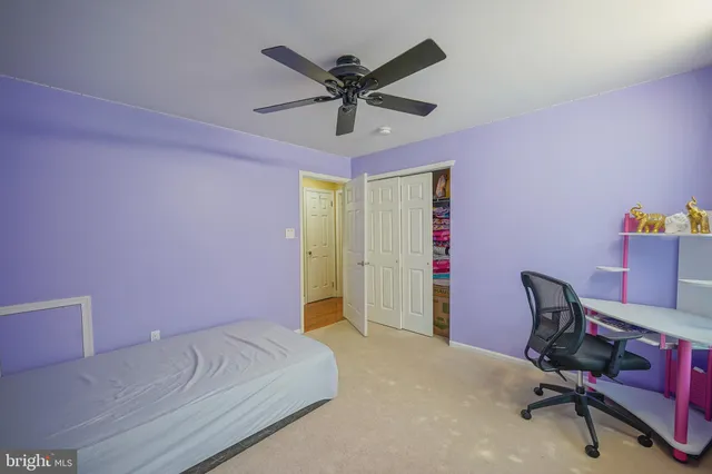 a bedroom with a workspace