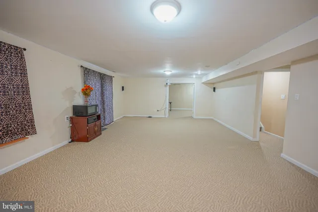 an empty room with furniture and closet