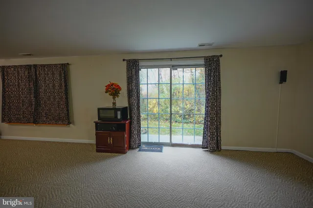 a room with a bed and a window