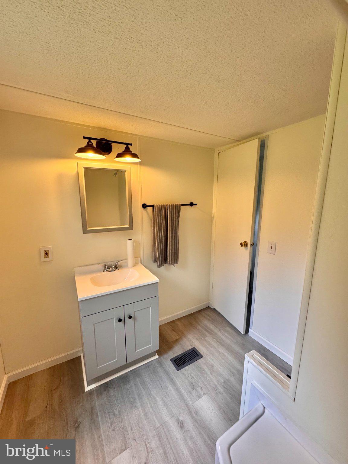 461 Long Point Road Hague, VA 22469 - Photo 14 of 25 Updated vanity, fixtures, mirror, and lighting
