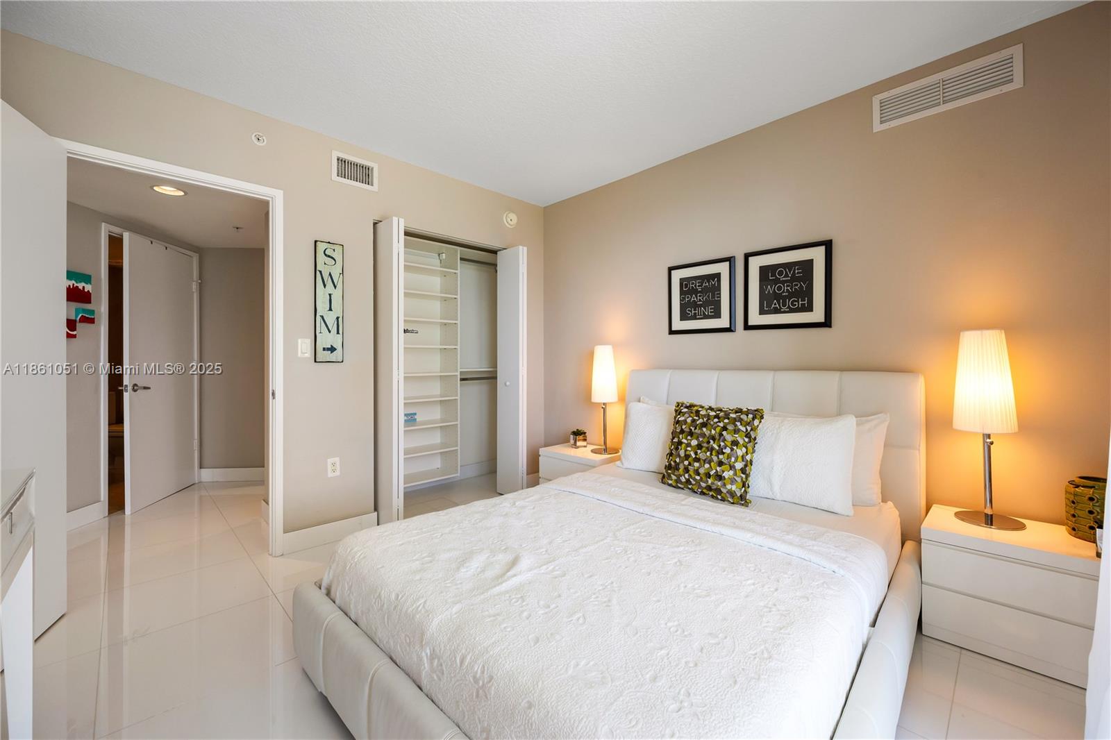 250 Sunny Isles Boulevard, Unit 31202 Sunny Isles Beach, FL 33160 - Photo 14 of 28 a bedroom with a bed and a couch