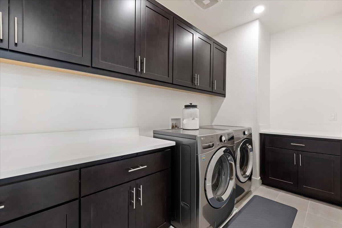 2005 Davoli Court San Ramon, CA 94583 - Photo 27 of 45 Upstairs Laundry Room with washer and dryer, light tile patterned flooring, cabinet space, and recessed lighting